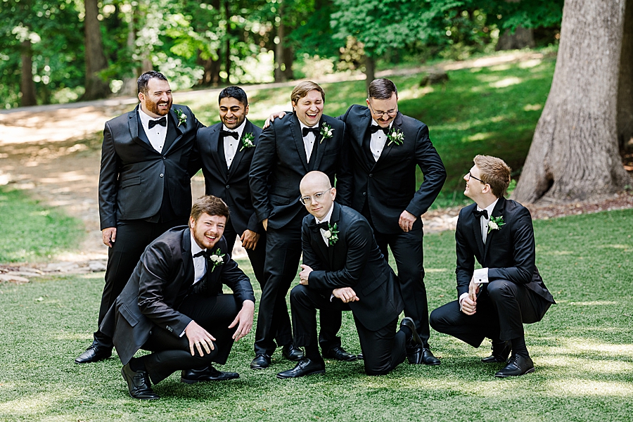 Groom and groomsmen laughing together at Julianna Wedding by Amanda May Photos