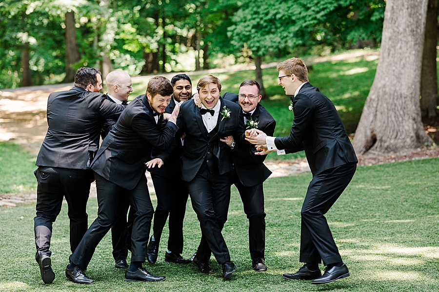 Groomsmen tackle groom at Julianna Wedding by Amanda May Photos