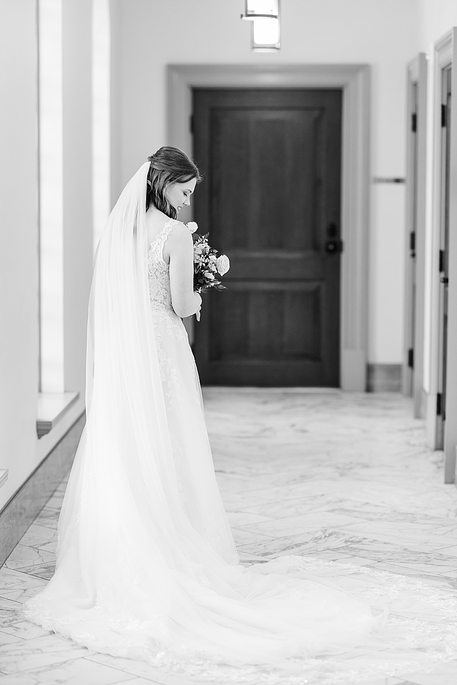 Bride looking at dress at Julianna Wedding by Amanda May Photos 