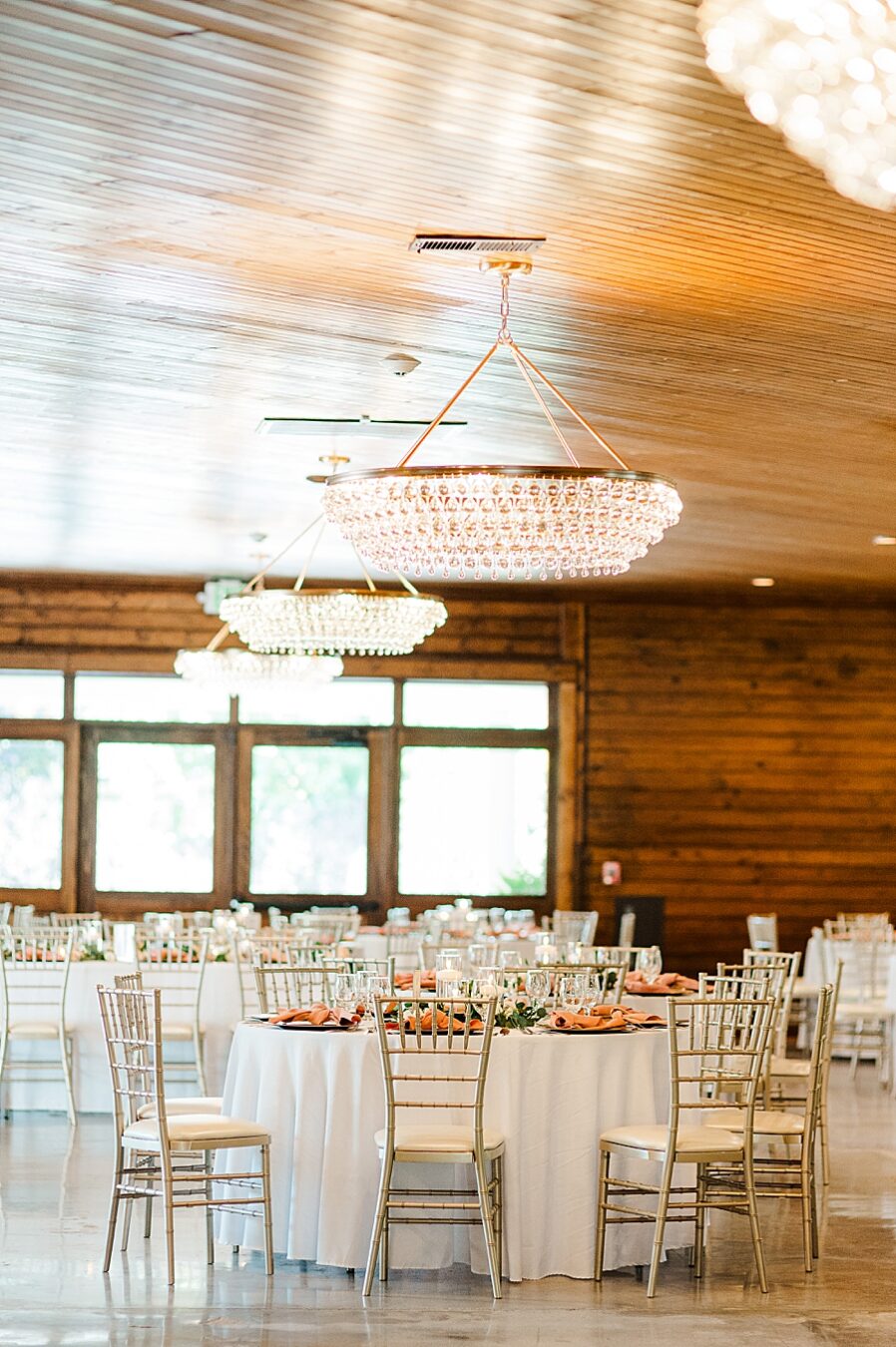 Tables and chairs at reception of wedding by Amanda May Photos