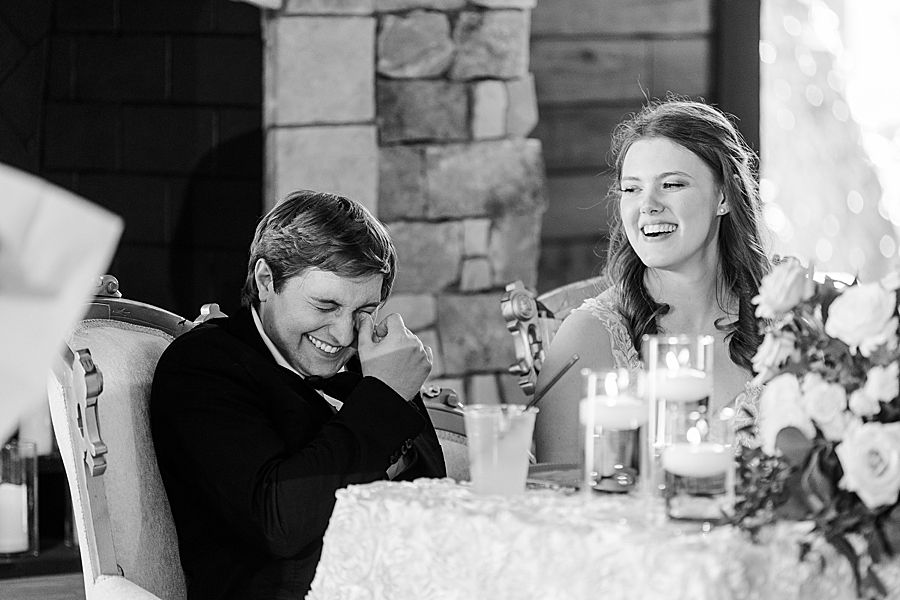 Groom laughing at wedding by Amanda May Photos