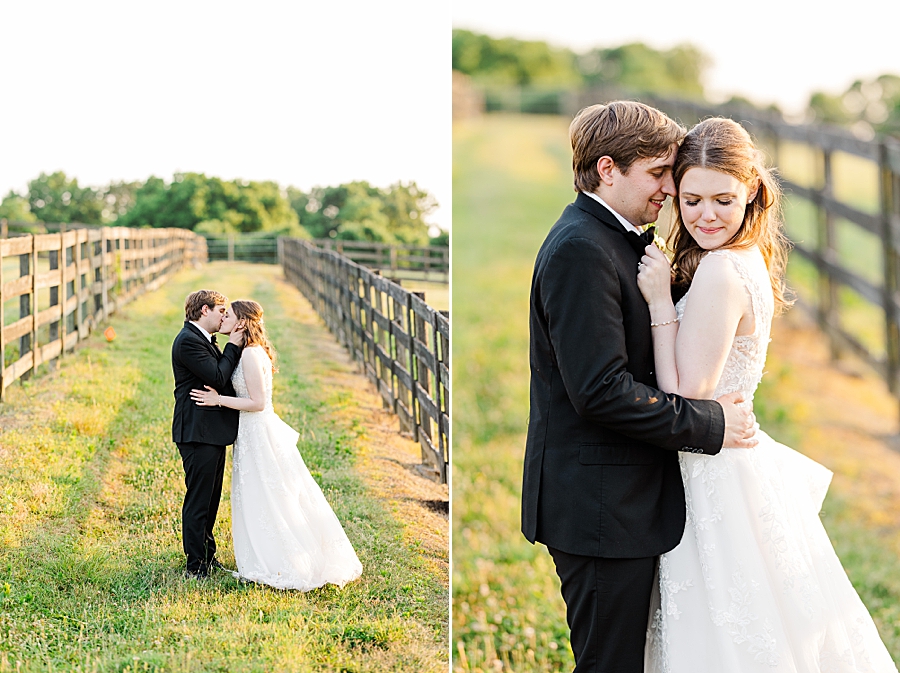 Kissing in a field at wedding by Amanda May Photos