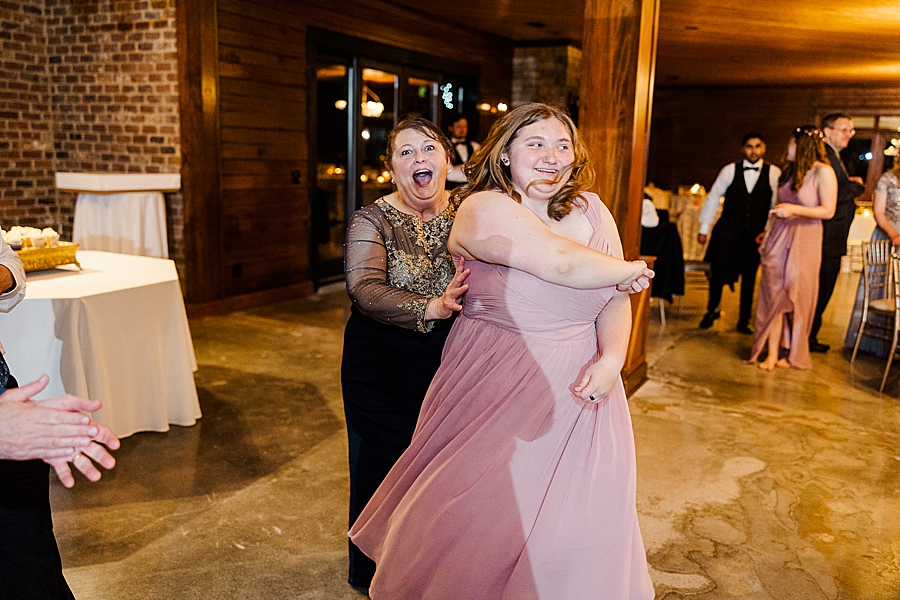 Mom and daughter dancing at wedding by Amanda May Photos