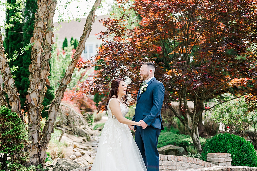 Laughing together at Carriage House Wedding by Amanda May Photos
