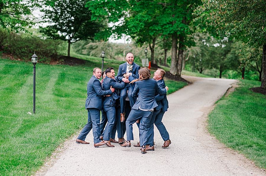 Groomsmen pick up groom at Carriage House Wedding by Amanda May Photos