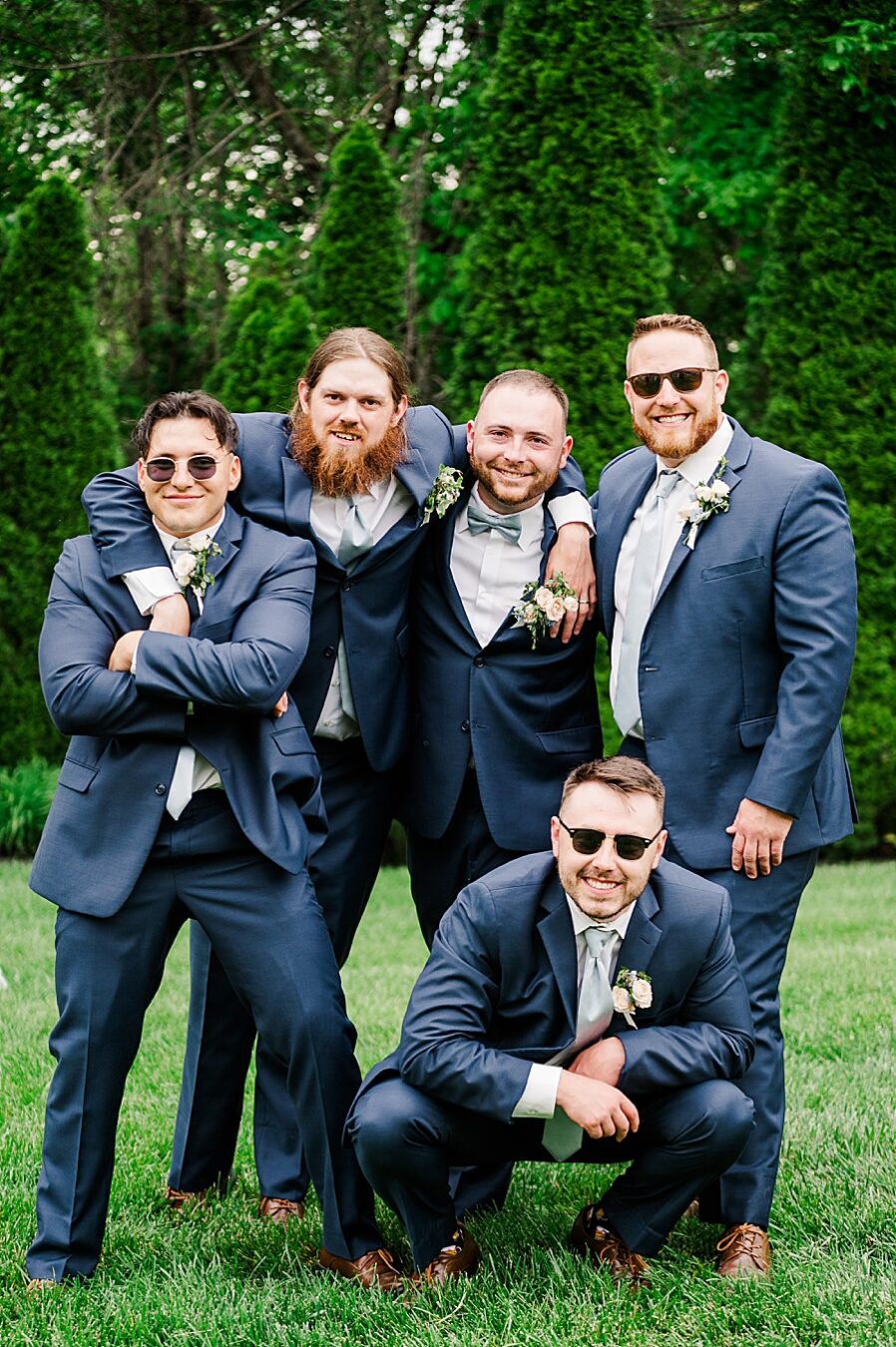 Groomsmen pose at Wedding by Amanda May Photos