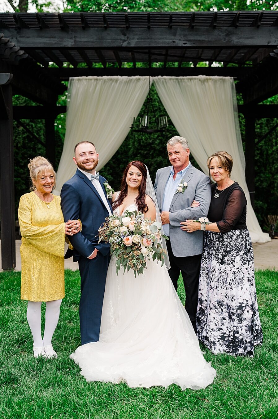 Family portrait at Wedding by Amanda May Photos