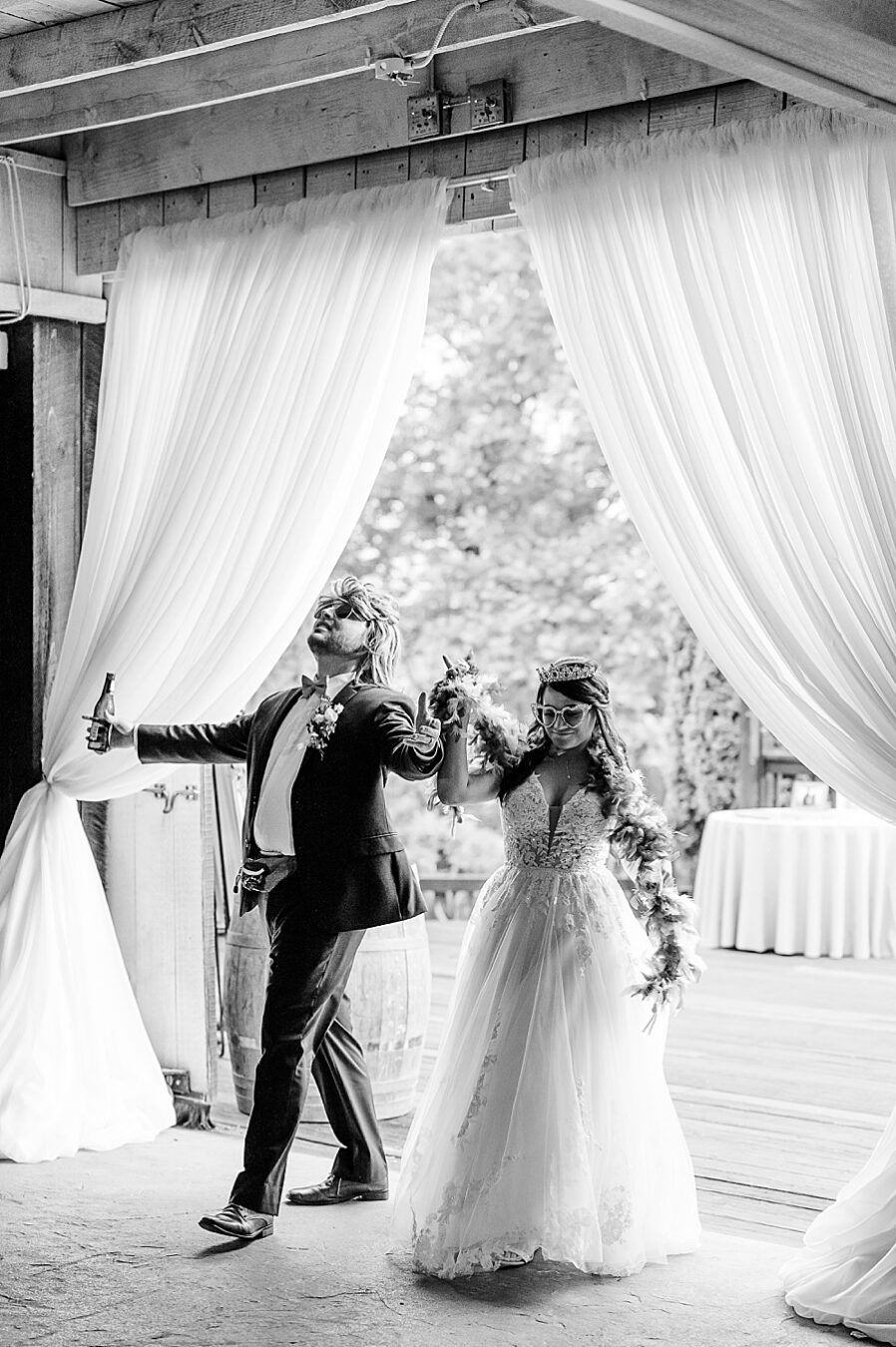 Bride and groom enters reception at Wedding by Amanda May Photos