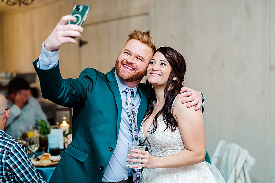 Bride and guest take a selfie at Wedding by Amanda May Photos