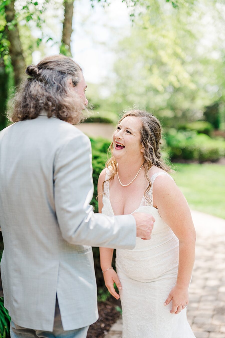 Smiling during Castleton Farms Wedding with a Rainbow by Amanda May Photos