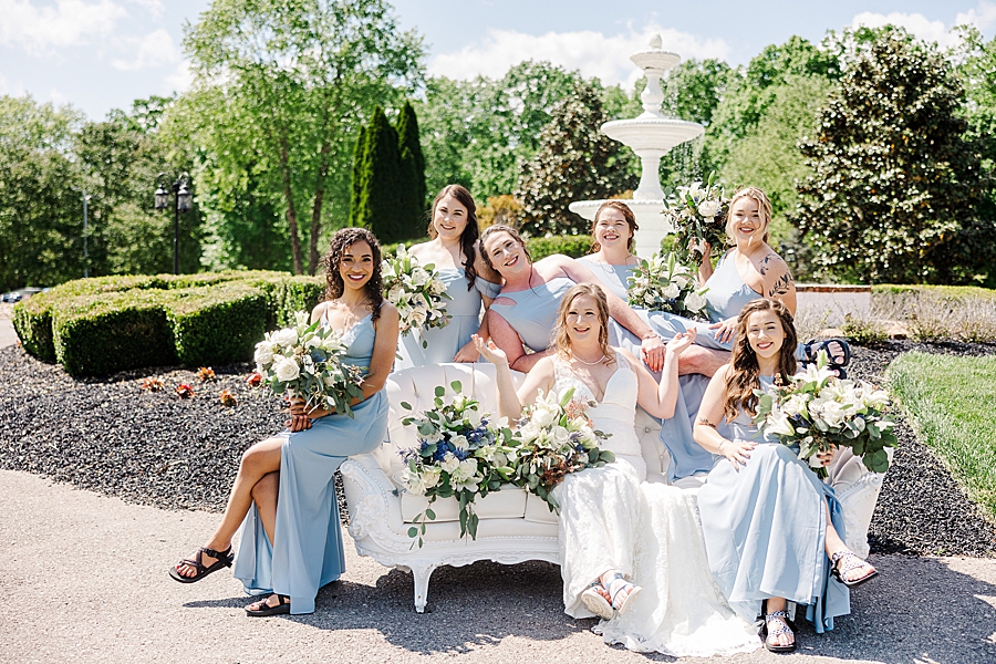 Bride and bridesmaids at Fountain at Castleton Farms Wedding with a Rainbow by Amanda May Photos