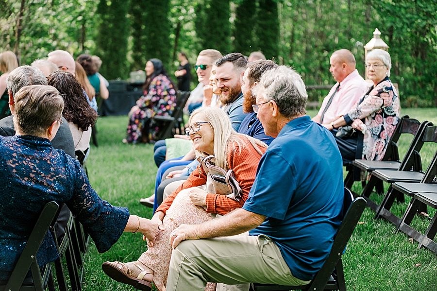 Guests talking at Castleton Farms Wedding by Amanda May Photos
