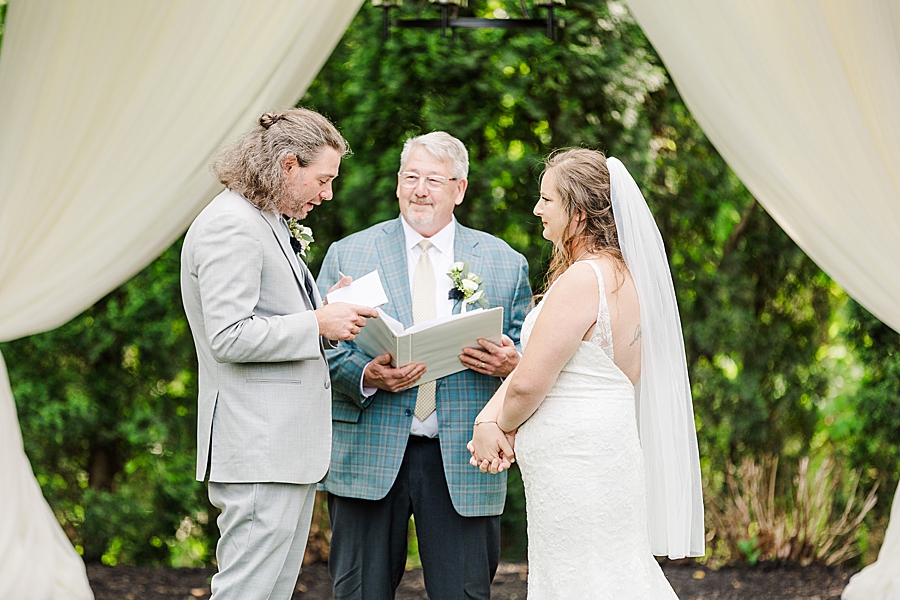 Groom saying vows at Castleton Farms Wedding by Amanda May Photos