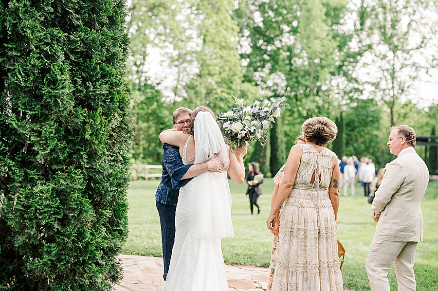 Hugging at Castleton Farms Wedding by Amanda May Photos