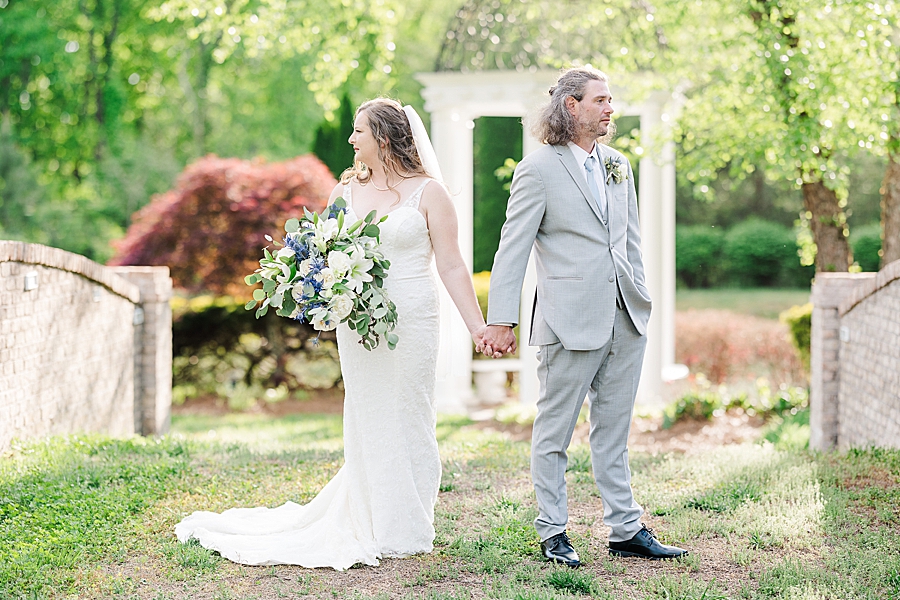 Holding hands at Castleton Farms Wedding by Amanda May Photos