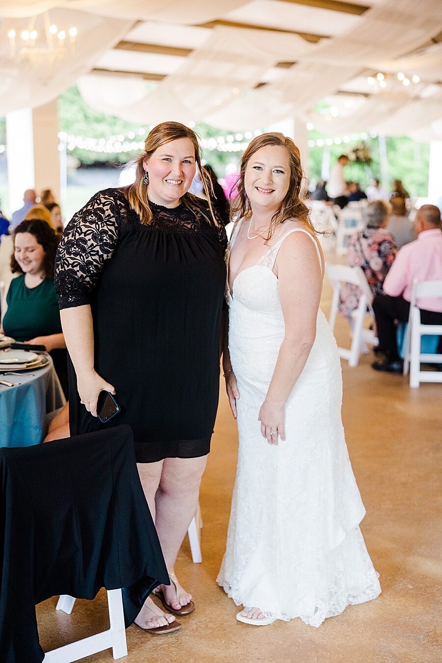 Smiling with guests at Castleton Farms Wedding by Amanda May Photos