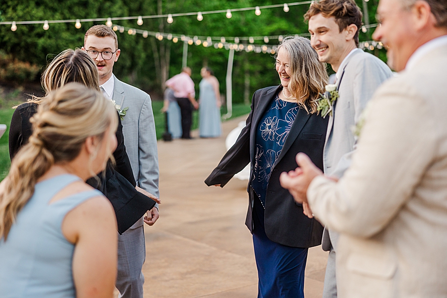 Guests laughing at Castleton Farms Wedding by Amanda May Photos