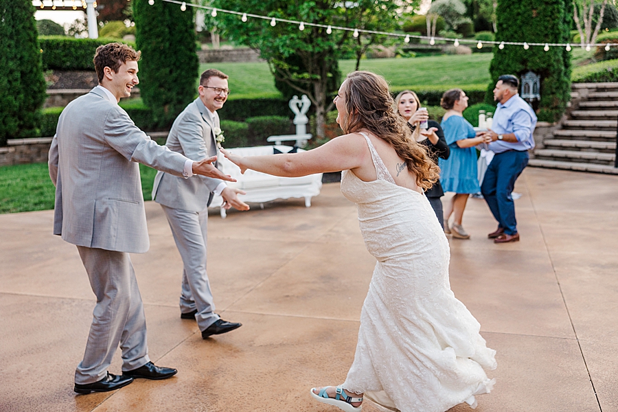 Bride and family dancing at Castleton Farms Wedding by Amanda May Photos