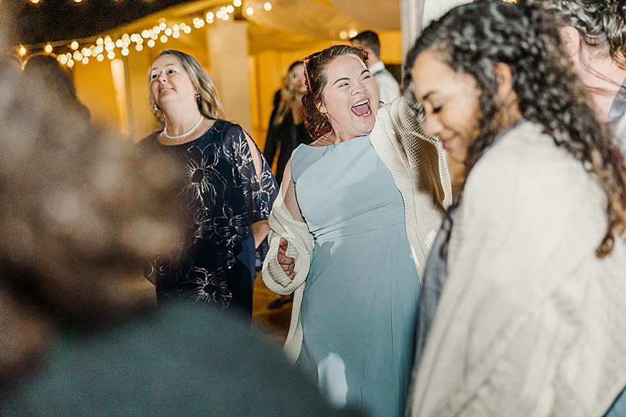 Guests laughing at Castleton Farms Wedding by Amanda May Photos