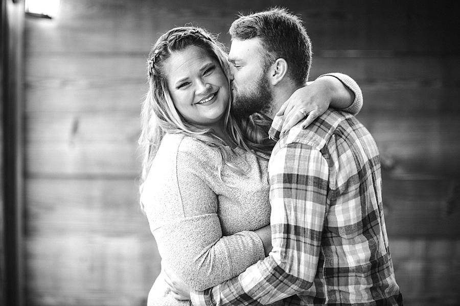 Kiss on the cheek at this The Stables at Strawberry Creek Engagement Session by Knoxville Wedding Photographer, Amanda May Photos.