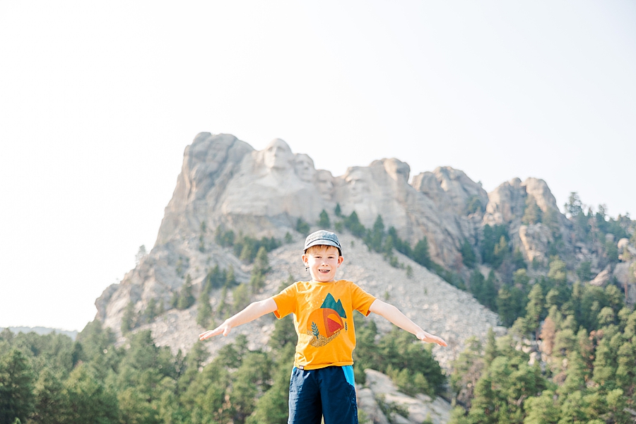 Boy standing in front of Mount Rushmore by Knoxville Wedding Photographer, Amanda May Photos.