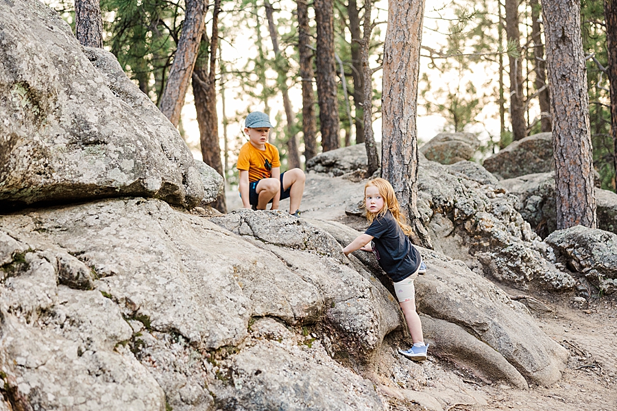 Two kids playing on rocks at Mount Rushmore by Knoxville Wedding Photographer, Amanda May Photos.