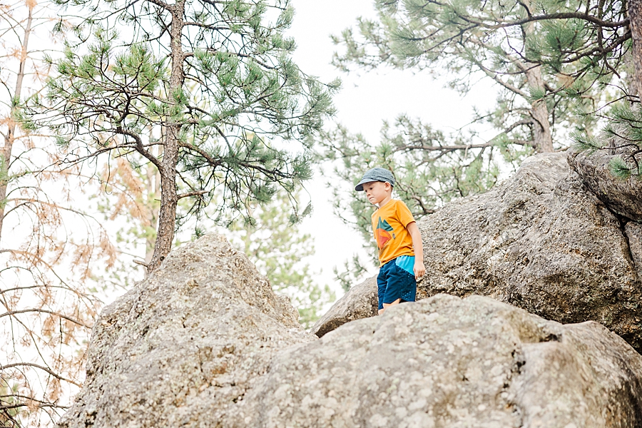 Little boy high on rocks at Mount Rushmore by Knoxville Wedding Photographer, Amanda May Photos.

