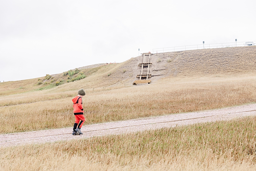 Little boy walking at Badlands National Park in South Dakota by Knoxville Wedding Photographer, Amanda May Photos.