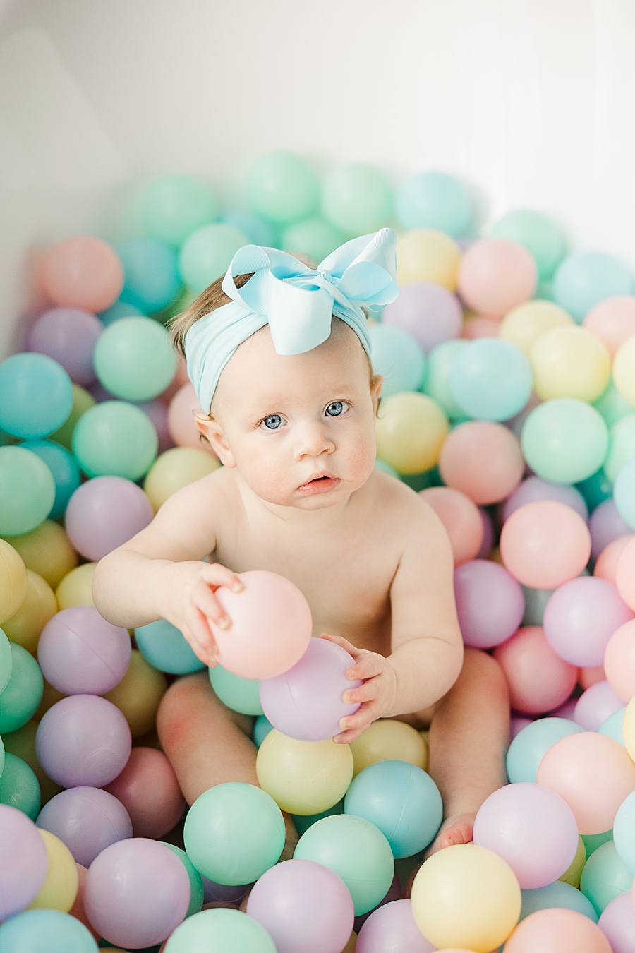 baby in ball pit