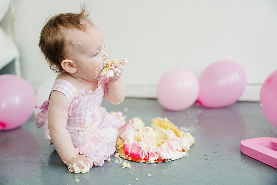 baby eating at cake smash