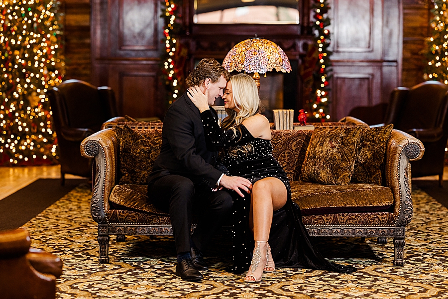 sitting on a couch at carnegie hotel engagement