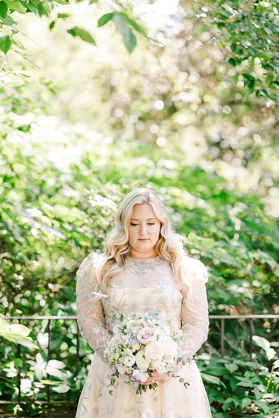 Bride looks at boutique at Knoxville Botanical Gardens Wedding by Amanda May Photos