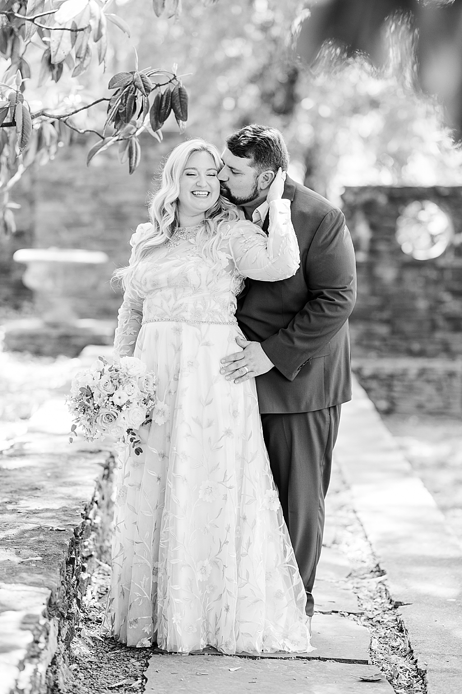Groom kisses bride's cheek at Knoxville Botanical Gardens Wedding by Amanda May Photos