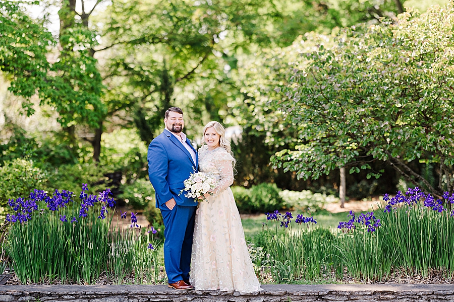 Smiling at the camera at Knoxville Botanical Gardens Wedding by Amanda May Photos