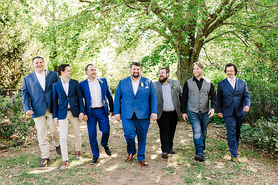 Groom and friends walking together at Knoxville Botanical Gardens Wedding by Amanda May Photos