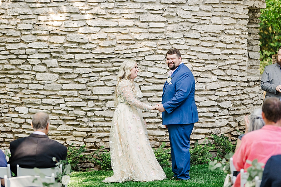 Bride and groom hold hands at Knoxville Botanical Gardens Wedding by Amanda May Photos