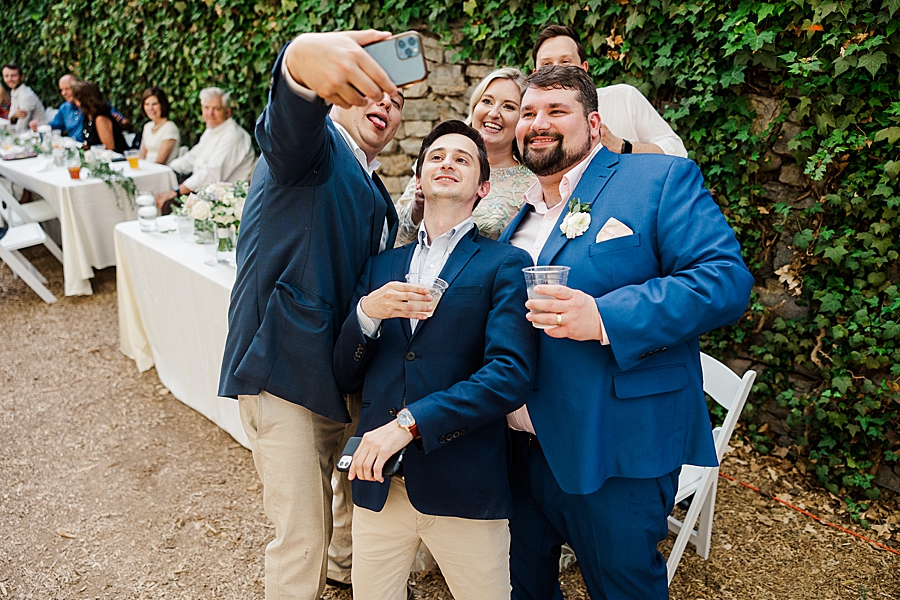 Bride and groom take a selfie with guests at Wedding by Amanda May Photos