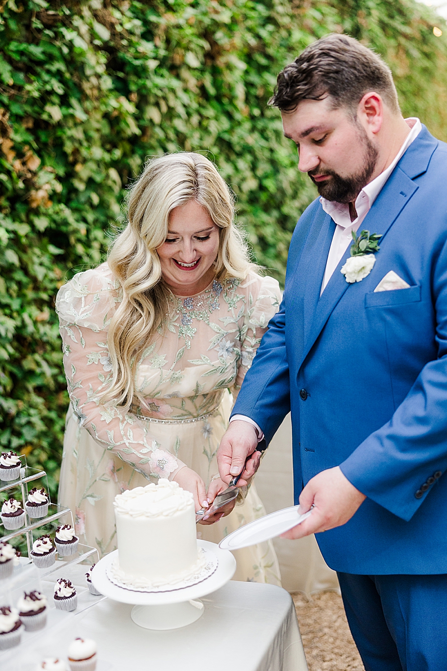Bride and groom cut cake at Wedding by Amanda May Photos