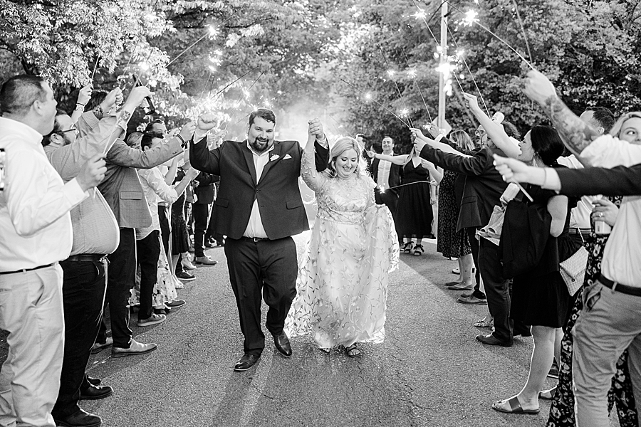 Celebrating with sparklers at Wedding by Amanda May Photos