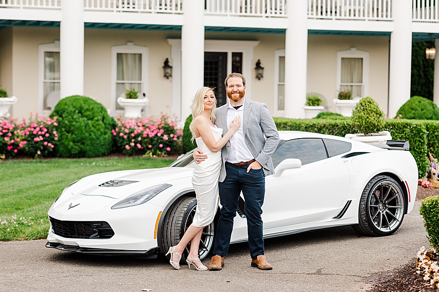 couple with corvette at castleton engagement