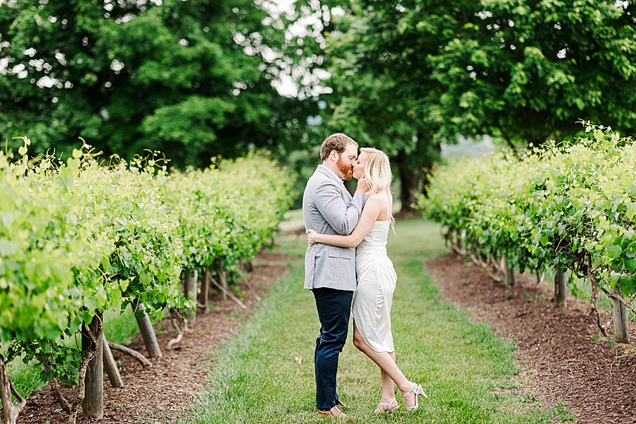 kissing in vineyard at castleton engagement