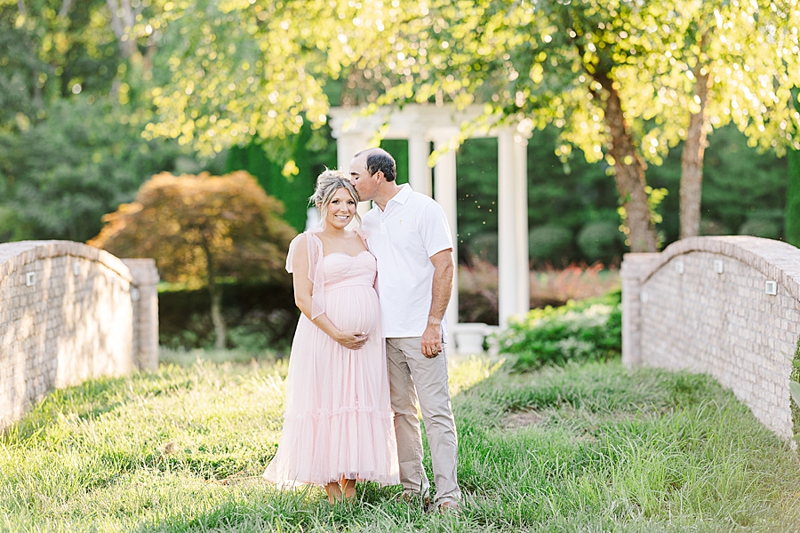 kiss on forehead at castleton farms maternity session