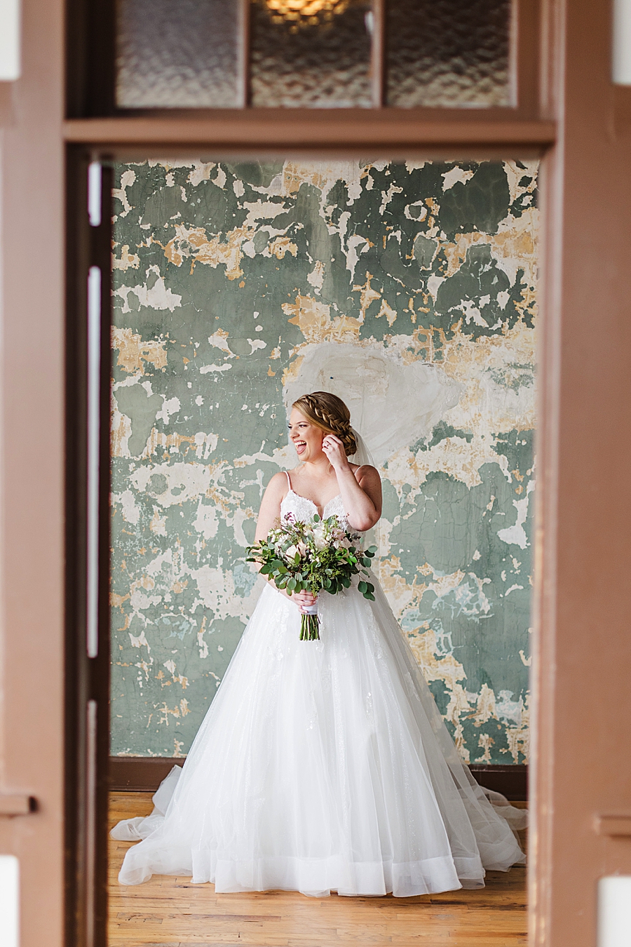 bride in doorway at this catholic wedding