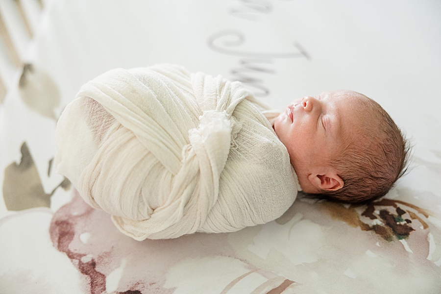 swaddled baby at christmas newborn session