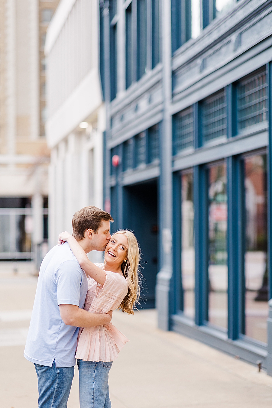 kiss on the cheek at downtown knoxville engagement