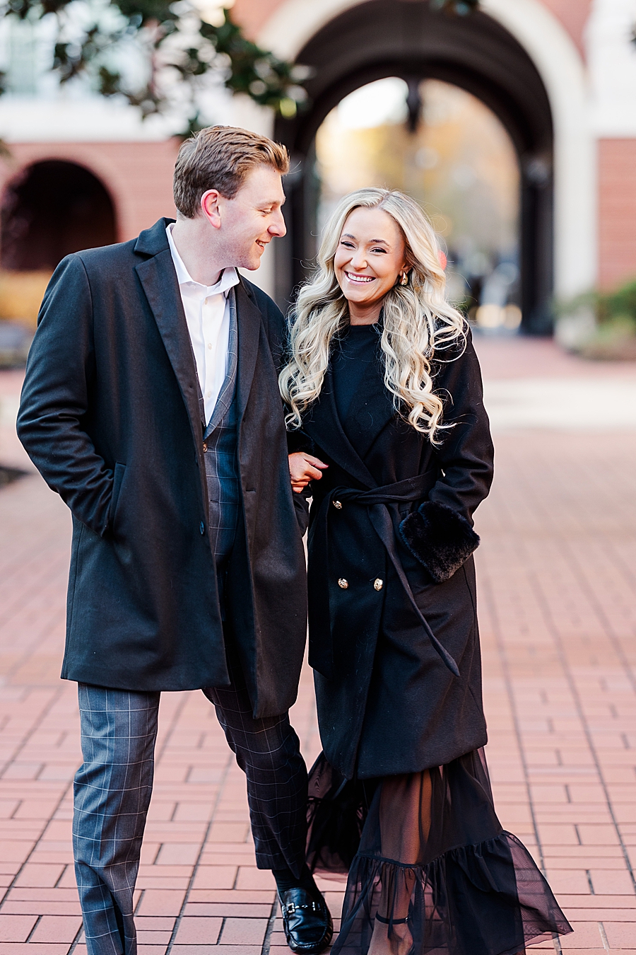 couple in coats at downtown knoxville winter engagement session