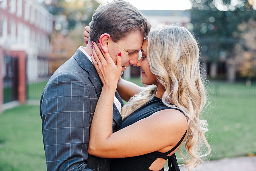 foreheads together at downtown knoxville winter engagement