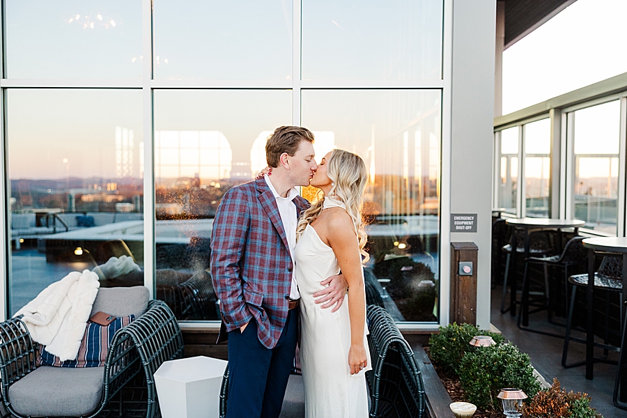 couple kissing at sunset