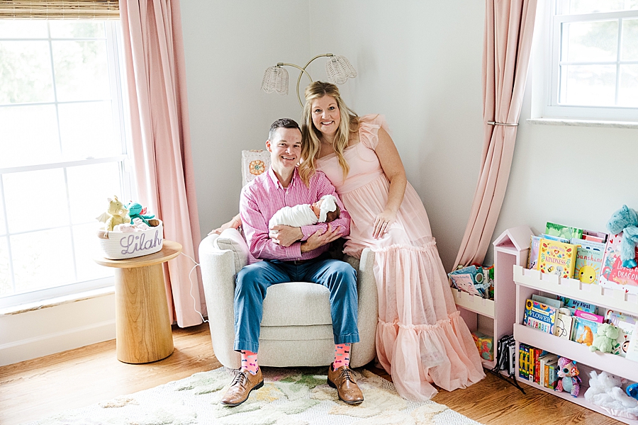 family of three in dragon nursery