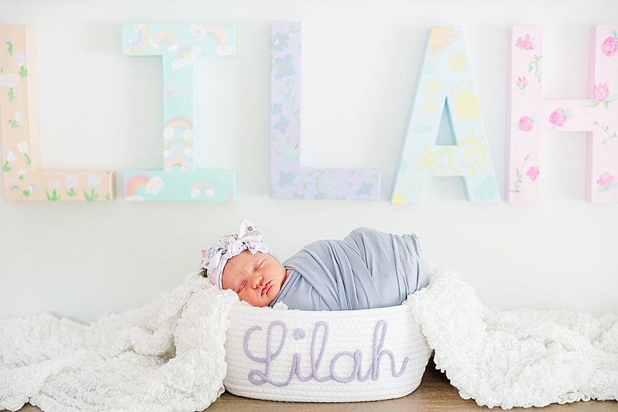 newborn in personalized basket